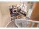 View from staircase overlooking living room with fireplace at 9048 E Cedar Waxwing Dr, Sun Lakes, AZ 85248