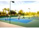 Well-maintained tennis courts with ample space for players at 9048 E Cedar Waxwing Dr, Sun Lakes, AZ 85248