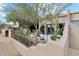 Partial view of home's exterior and landscaping at 9250 E Whitethorn Cir, Scottsdale, AZ 85266