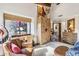 Home office with leather chair and built-in wooden cabinet at 9250 E Whitethorn Cir, Scottsdale, AZ 85266