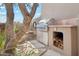 Stainless steel grill and stone outdoor kitchen with wood storage at 9250 E Whitethorn Cir, Scottsdale, AZ 85266
