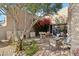 Peaceful patio with seating, grill, and water feature at 9250 E Whitethorn Cir, Scottsdale, AZ 85266