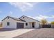 Charming single-story home featuring a well-maintained front yard and an attached two-car garage at 11125 W Torren Dr, Arizona City, AZ 85123