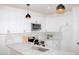 Well-equipped kitchen featuring stainless steel appliances, white cabinets and marble countertops at 11125 W Torren Dr, Arizona City, AZ 85123