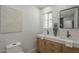 Bathroom featuring a double sink vanity with modern fixtures and decor at 1323 W Tuckey Ln, Phoenix, AZ 85013