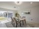 Bright dining room with sliding glass doors to the patio and modern decor at 1323 W Tuckey Ln, Phoenix, AZ 85013