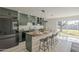 Modern kitchen with sage green cabinets, butcher block countertops and island with seating at 1323 W Tuckey Ln, Phoenix, AZ 85013