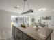 Spacious kitchen overlooking the dining area, with island and modern finishes at 1323 W Tuckey Ln, Phoenix, AZ 85013