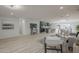 Open-concept living space with a kitchen, dining area, and modern furnishings at 1323 W Tuckey Ln, Phoenix, AZ 85013