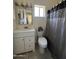 Clean bathroom with white vanity, toilet and shower at 1409 E Apollo Rd, Phoenix, AZ 85042