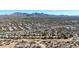 Aerial view of community and surrounding area with mountain range at 23635 N 75Th Pl, Scottsdale, AZ 85255