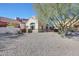Gravel backyard with a view of the home's exterior at 23635 N 75Th Pl, Scottsdale, AZ 85255