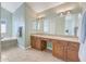 Elegant bathroom with double vanity, soaking tub, and separate shower at 23635 N 75Th Pl, Scottsdale, AZ 85255