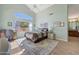 Comfortable bedroom featuring a window seat and en-suite bathroom access at 23635 N 75Th Pl, Scottsdale, AZ 85255
