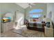 Bright bedroom with vaulted ceiling, large window, and access to backyard at 23635 N 75Th Pl, Scottsdale, AZ 85255