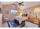 Cozy bedroom with vaulted ceilings and a view of the courtyard at 23635 N 75Th Pl, Scottsdale, AZ 85255