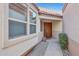 House entrance with double doors and side yard landscaping at 23635 N 75Th Pl, Scottsdale, AZ 85255