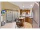 Kitchen with island, stainless steel appliances, and wood cabinets at 23635 N 75Th Pl, Scottsdale, AZ 85255
