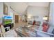 Open living area with hardwood floors and access to patio at 23635 N 75Th Pl, Scottsdale, AZ 85255