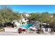 Community pool with surrounding landscaping and mountain views at 23635 N 75Th Pl, Scottsdale, AZ 85255