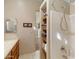 Bathroom with shower, built-in shelves, and tile surround at 2697 E Via Del Arboles --, Gilbert, AZ 85298