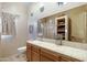 Bathroom with wood cabinets, tile flooring, and a shower at 2697 E Via Del Arboles --, Gilbert, AZ 85298