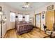 Bedroom with wood floors, double bed, and access to a door at 2697 E Via Del Arboles --, Gilbert, AZ 85298