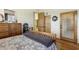 Guest bedroom with wood floors and an adjacent door at 2697 E Via Del Arboles --, Gilbert, AZ 85298