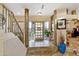 Grand entryway with a wooden door, tile flooring, and a staircase at 2697 E Via Del Arboles --, Gilbert, AZ 85298