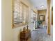 Light and airy entryway with wood-look tile floors and plantation shutters at 2697 E Via Del Arboles --, Gilbert, AZ 85298