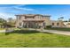 Two-story home with Spanish-style architecture, landscaping, and a large driveway at 2697 E Via Del Arboles --, Gilbert, AZ 85298