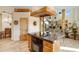 Kitchen with granite island, breakfast bar and views into the dining area at 2697 E Via Del Arboles --, Gilbert, AZ 85298