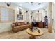 Second living area with a comfortable leather sofa and wooden coffee table at 2697 E Via Del Arboles --, Gilbert, AZ 85298