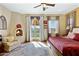 Main bedroom with king bed, fireplace, and access to patio at 2697 E Via Del Arboles --, Gilbert, AZ 85298