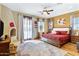Spacious main bedroom with king bed, fireplace, and access to balcony at 2697 E Via Del Arboles --, Gilbert, AZ 85298