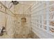Elegant shower with glass block wall and beige tile at 2697 E Via Del Arboles --, Gilbert, AZ 85298