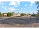 Spacious backyard with gravel and mature trees at 10515 W Oak Ridge Dr, Sun City, AZ 85351