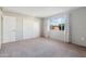 Spacious bedroom with neutral walls and carpet flooring at 10515 W Oak Ridge Dr, Sun City, AZ 85351