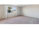 Simple bedroom with neutral walls and carpeted floor at 10515 W Oak Ridge Dr, Sun City, AZ 85351