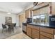 Kitchen with wood cabinets, and view to backyard at 10515 W Oak Ridge Dr, Sun City, AZ 85351