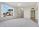 Living room with large window and view of street at 10515 W Oak Ridge Dr, Sun City, AZ 85351