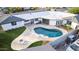 Aerial view showcasing a home with a backyard pool, patio, and lush green landscaping at 1345 W Edgemont Ave, Phoenix, AZ 85007