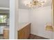 A home bar featuring a stylish light fixture and ample storage at 1345 W Edgemont Ave, Phoenix, AZ 85007