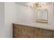 A home bar featuring a stylish light fixture and ample countertop space at 1345 W Edgemont Ave, Phoenix, AZ 85007