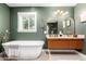 Elegant bathroom with double sinks, freestanding tub, and modern fixtures at 1345 W Edgemont Ave, Phoenix, AZ 85007