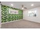Bright bedroom with leafy wallpaper, white trim, and lots of natural light at 1345 W Edgemont Ave, Phoenix, AZ 85007