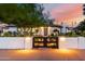 Beautiful exterior shot of updated home featuring modern black fence and fresh landscape at 1345 W Edgemont Ave, Phoenix, AZ 85007