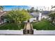 Charming home featuring a black privacy gate, manicured lawn and white painted brick perimeter at 1345 W Edgemont Ave, Phoenix, AZ 85007