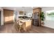 Modern kitchen with island seating, stainless steel appliances, and ample cabinet space at 1345 W Edgemont Ave, Phoenix, AZ 85007