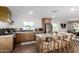 Updated kitchen with island seating, stylish backsplash, and stainless steel appliances at 1345 W Edgemont Ave, Phoenix, AZ 85007